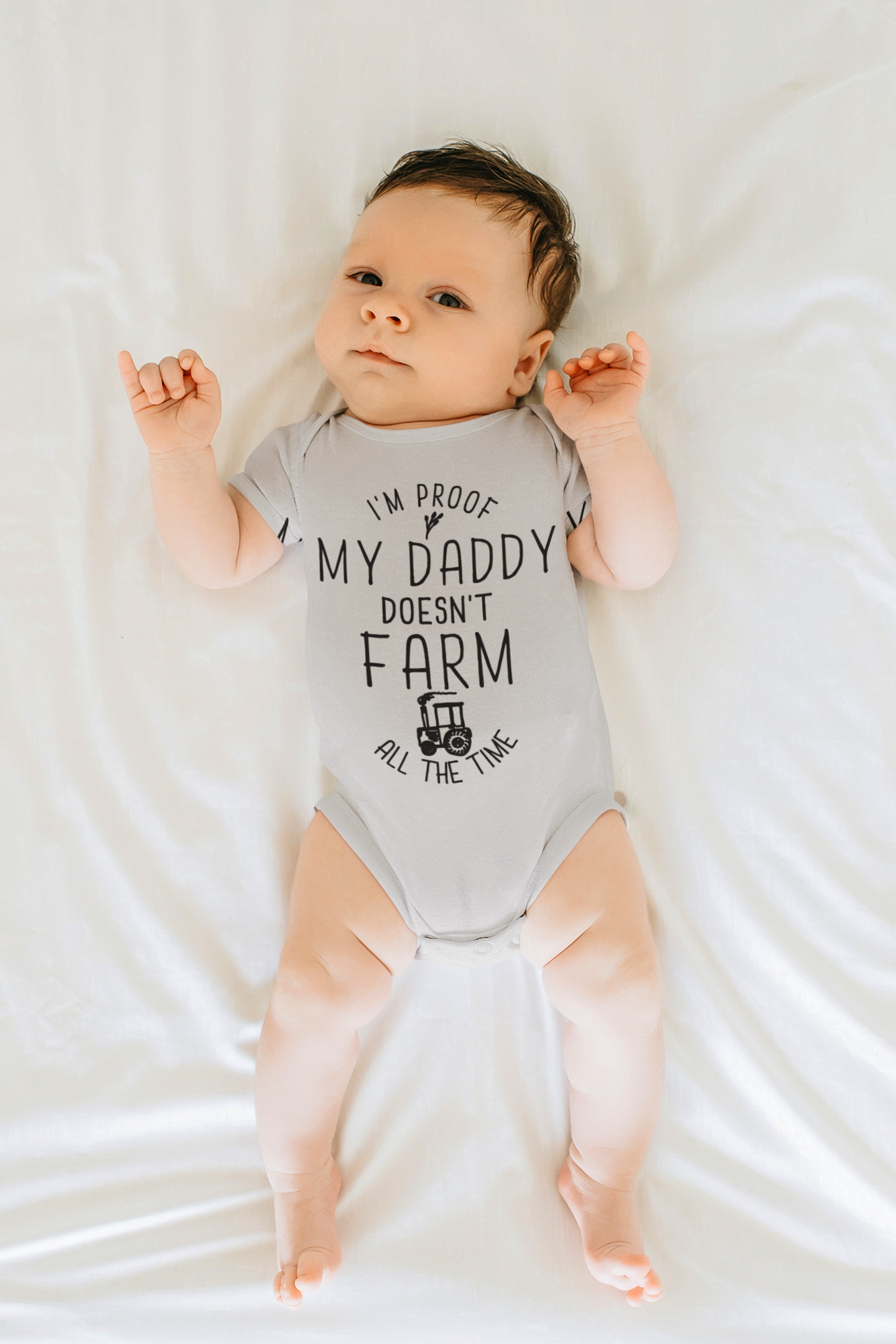 I'm Proof My Daddy Doesn't Farm All The Time Baby Bodysuit.