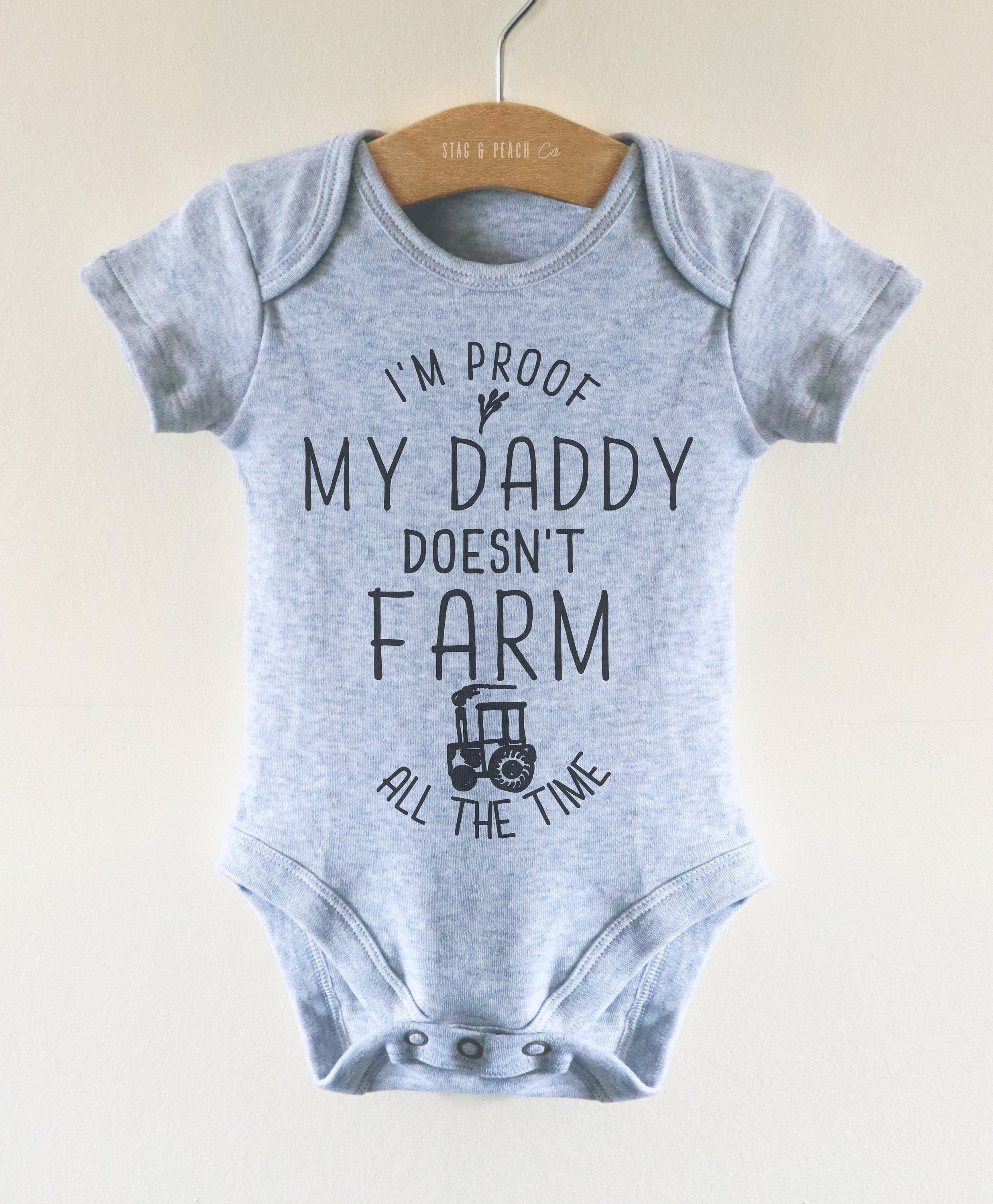 I'm Proof My Daddy Doesn't Farm All The Time Baby Bodysuit.